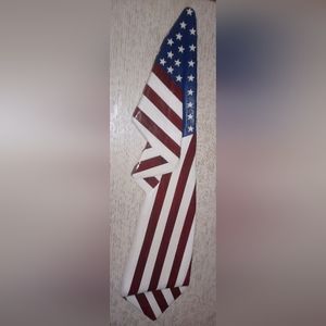Hand carved draped American flag about 12 inches wide and between 4 to 5 ft tall